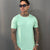 Camiseta Long Line Volk Culture Verde Menta Gola Canoa